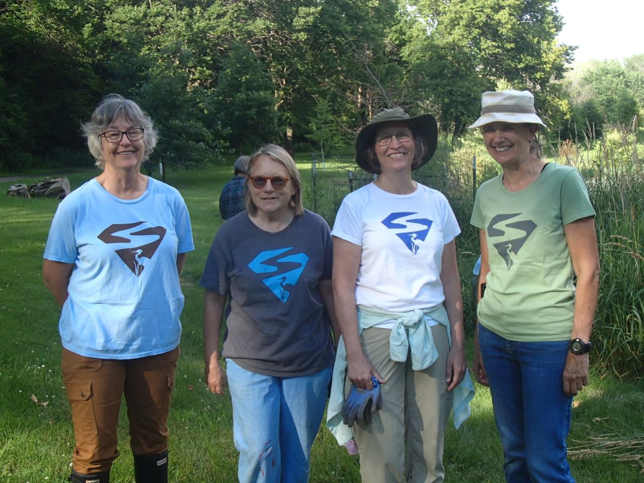 Four different versions of the SuperVolunteer shirt on display at the 2019 Crosby Farm Park tending