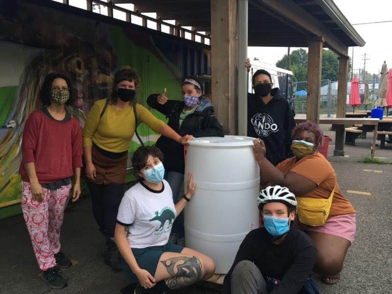 Rain barrel at Urban Ventures FMR and Plant Grow Share with an installed rain barrel at the Urban Ventures farm stand