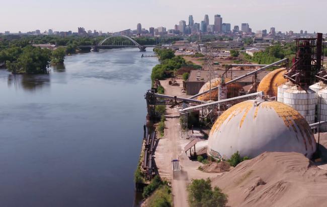An aerial photo of the abandoned industrial buildings next to the river at Upper Harbor Terminal.